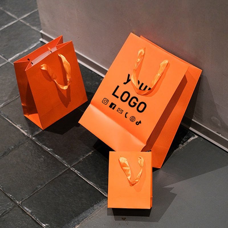Event Party Shop - 10 Stück Orange Kleidungs-Tragetaschen Feiertags-Geschenktüten Einkaufstaschen